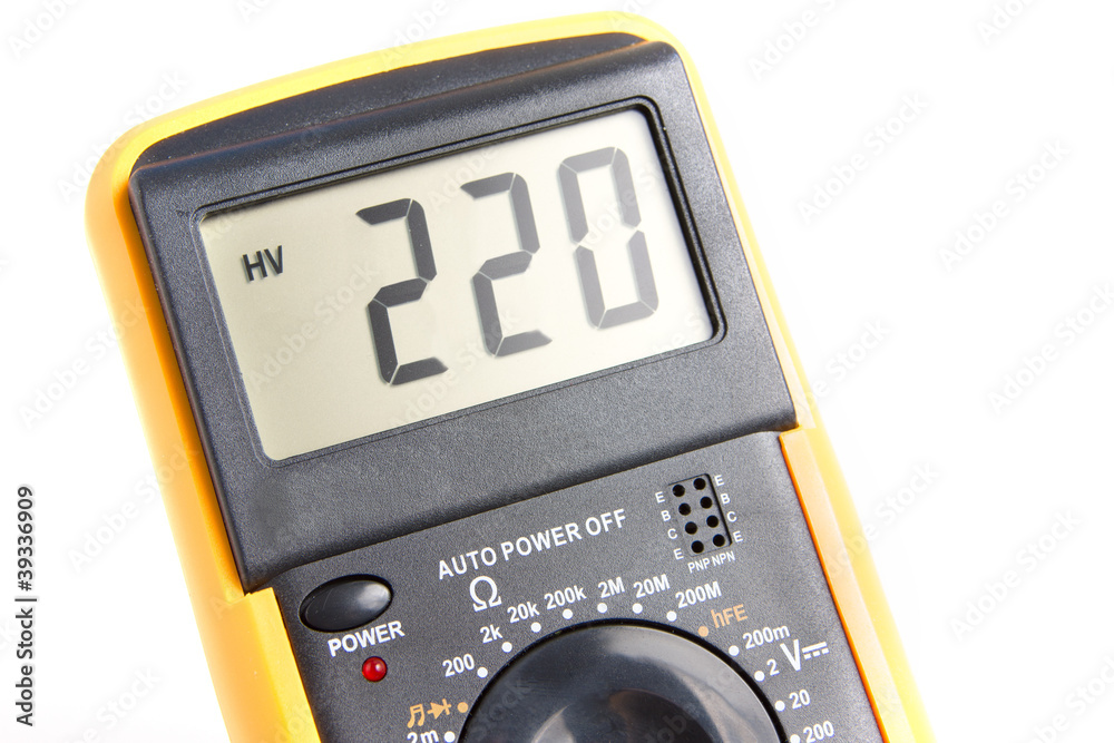Digital multimeter showing 220 V