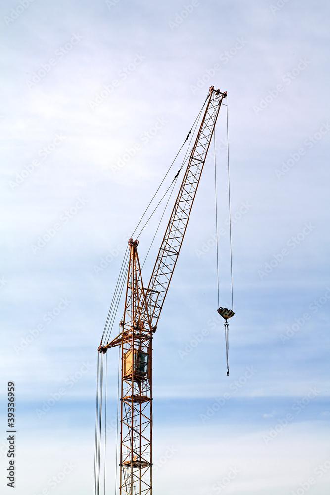 building crane on cloudy background