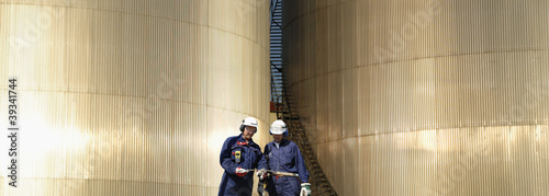 fuel-storage towers and oil-workers