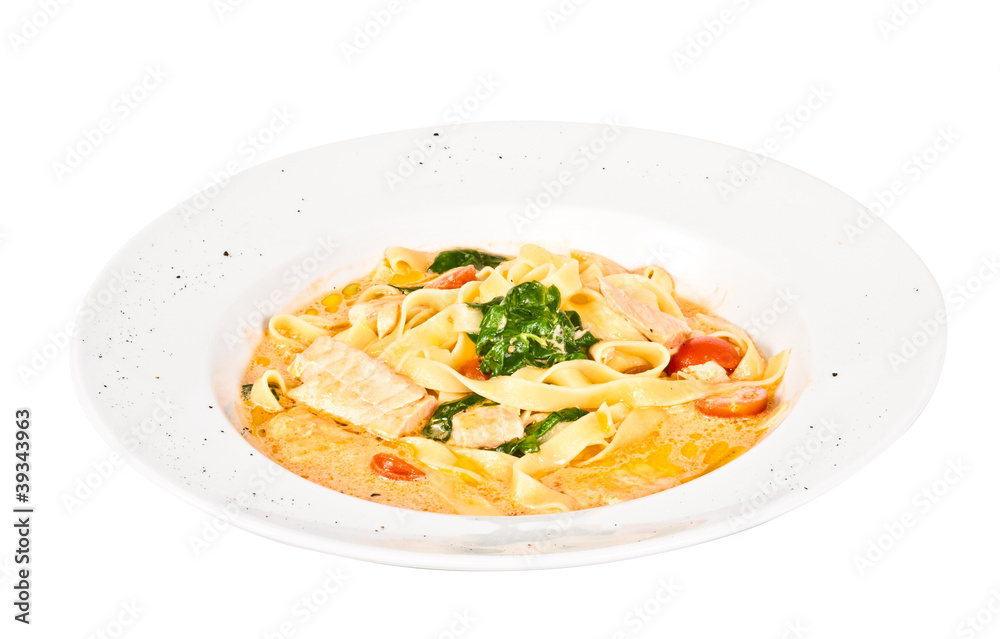 tasty pasta with cream, salmon, cheese and parsley close up