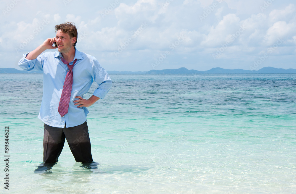Business man calling by cell phone on the beach Business man calling by cell phone on the beach