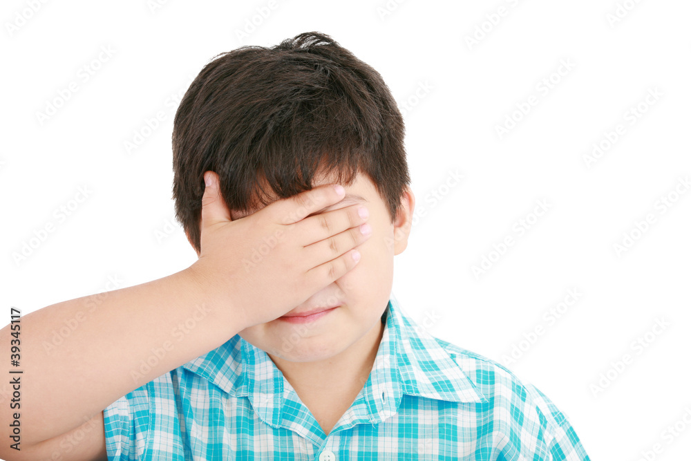 portrait of sad crying little boy covers his face with her hand portrait of sad crying little boy covers his face with her hand