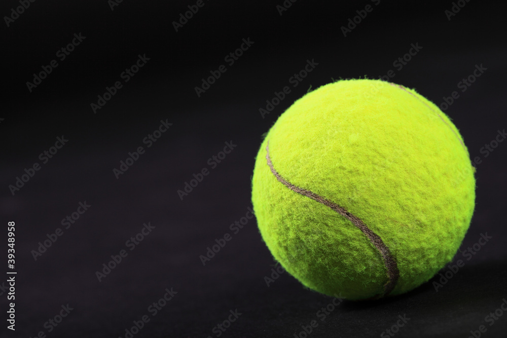 tennis balls on black background studio shot