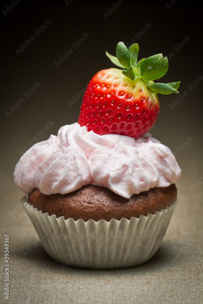Muffin with strawberry and sweet cream Muffin with strawberry and sweet cream
