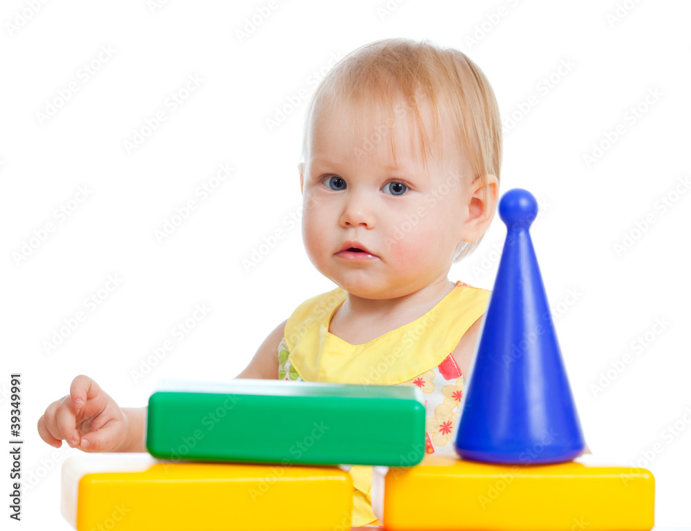 Little girl playing with colorful building blocks toys. Isolated Little girl playing with colorful building blocks toys. Isolated