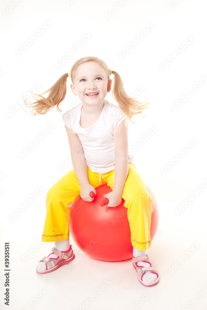 cute sly little girl doing gymnastic exercise with bal cute sly little girl doing gymnastic exercise with bal