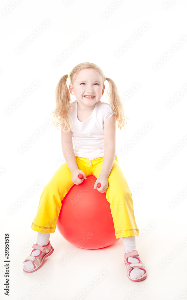 cute sly little girl doing gymnastic exercise with ball cute sly little girl doing gymnastic exercise with ball