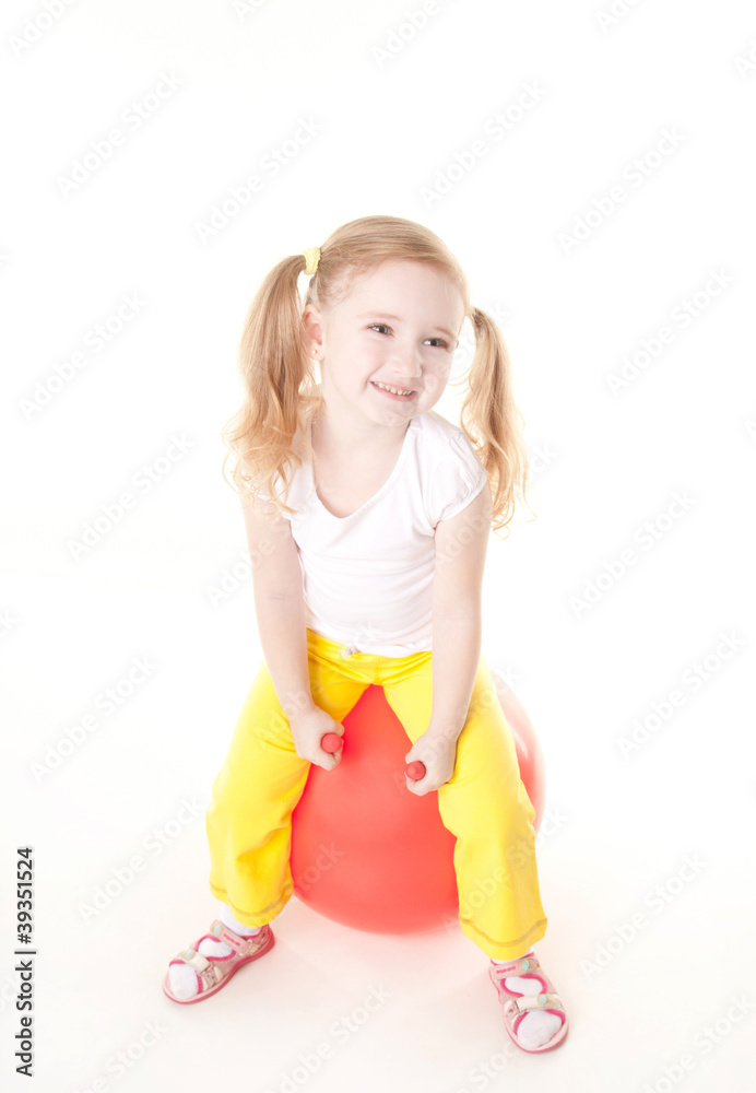 cute sly little girl doing gymnastic exercise with ball cute sly little girl doing gymnastic exercise with ball
