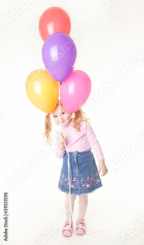 studio shot of pretty little girl with balloons © Shy
