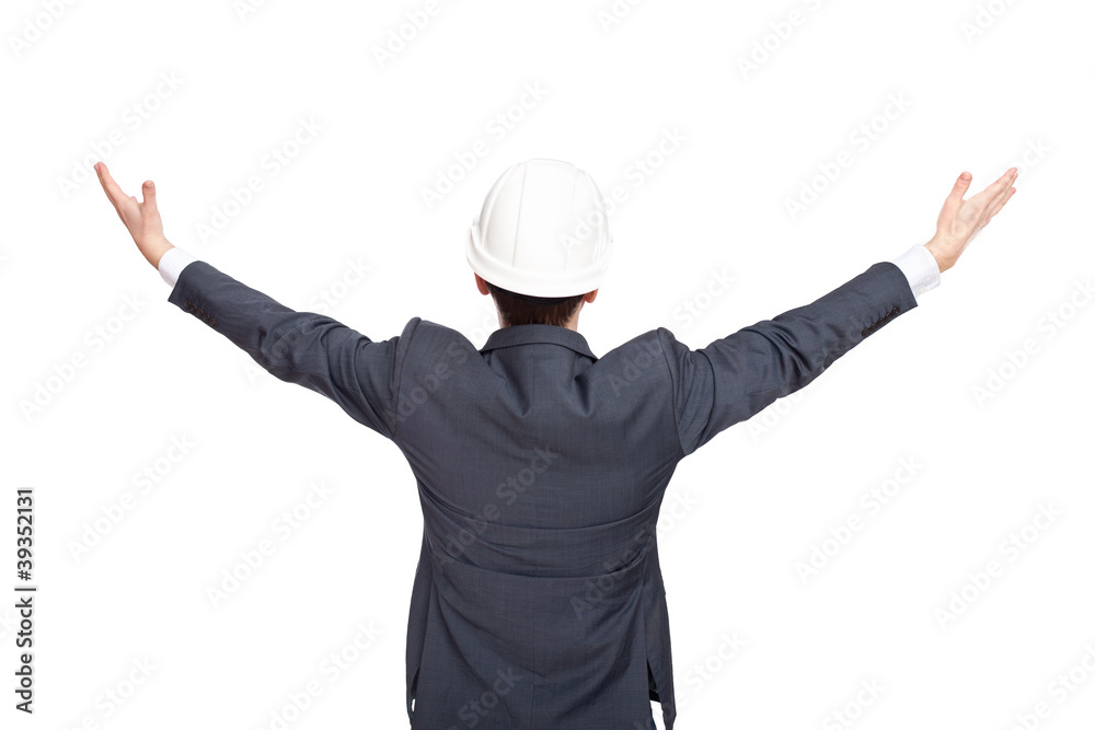 Engineer standing back view holding his arms up isolated on whit Engineer standing back view holding his arms up isolated on whit