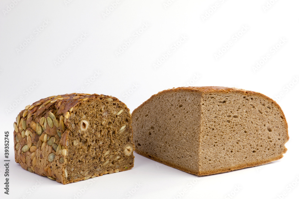 Zwei angeschnittenen Laibe Brot Zwei angeschnittenen Laibe Brot