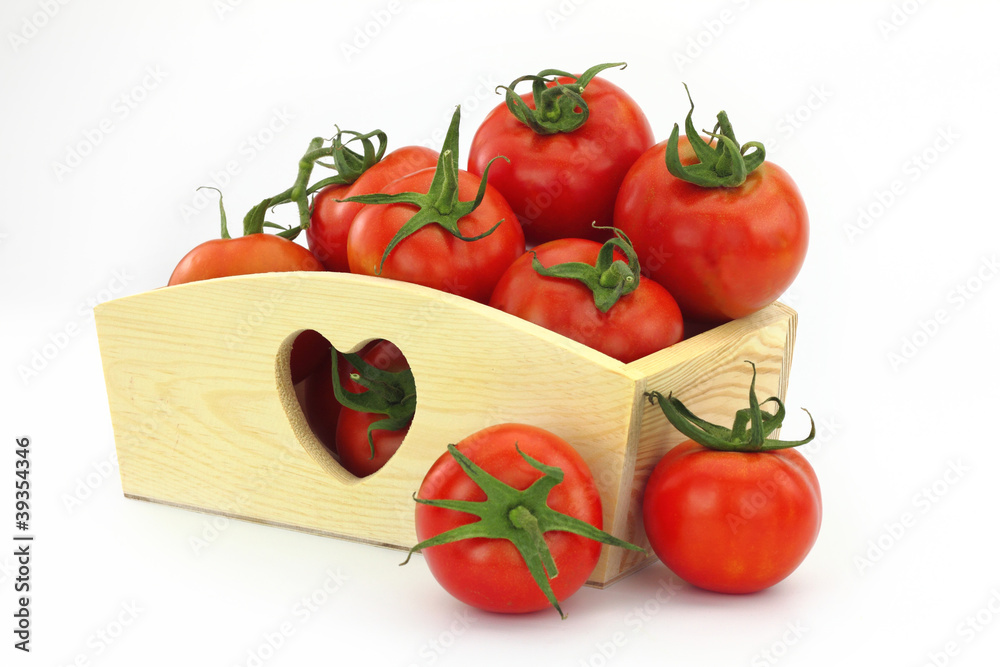 Wooden box full of tomatoes Wooden box full of tomatoes