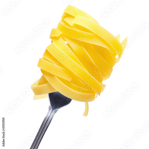 Fettuccine on fork isolated on white background