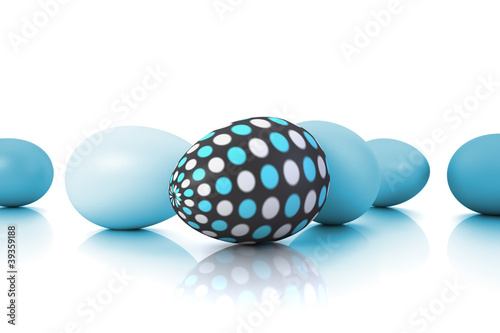 eggs in various shades of cyans and dotted egg on white ground