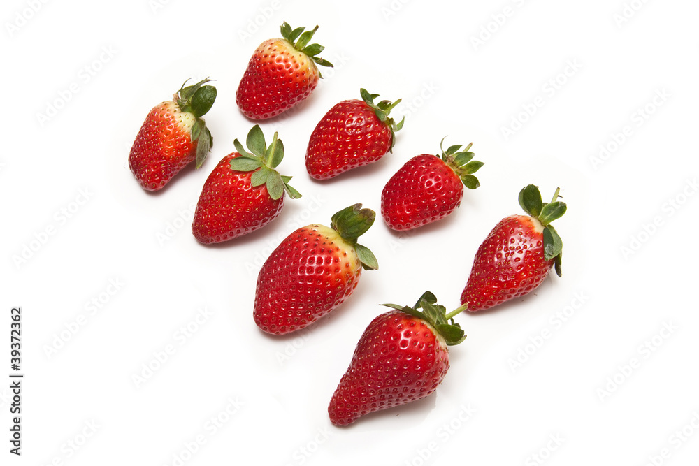Strawberries isolated on a white studio background. Strawberries isolated on a white studio background.