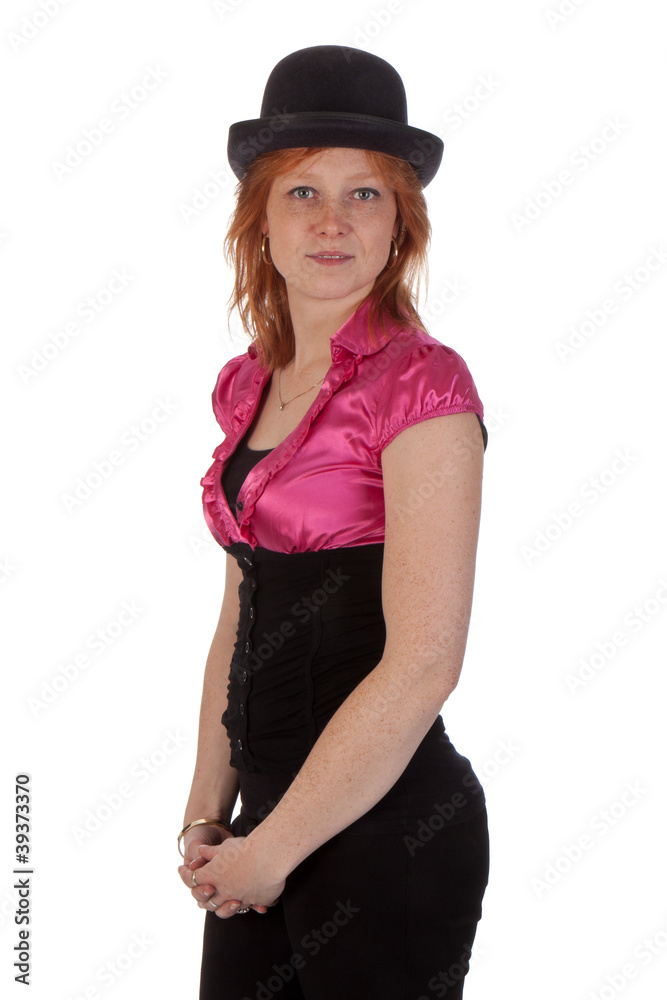 Pretty redhear girl in a pink blouse with a bowler Pretty redhear girl in a pink blouse with a bowler