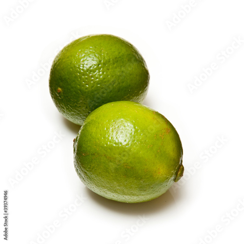 Lemons and Limes isolated on a white studio background.