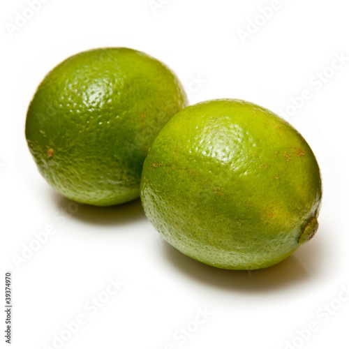 Lemons and Limes isolated on a white studio background.