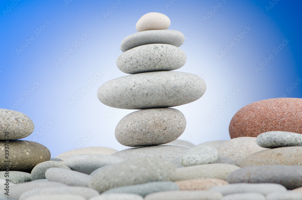 Pebbles stack against gradient background Pebbles stack against gradient background