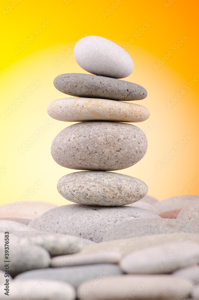 Pebbles stack against gradient background Pebbles stack against gradient background
