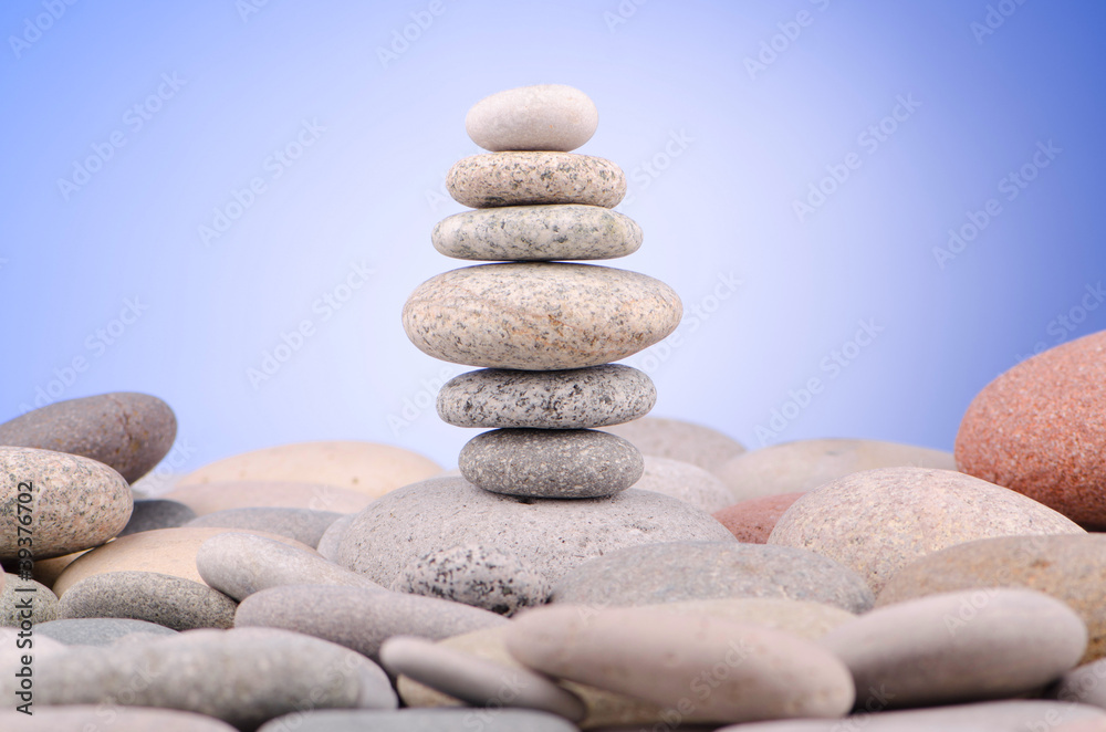 Pebbles stack against gradient background Pebbles stack against gradient background