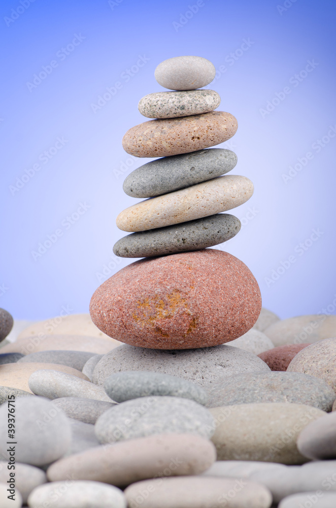 Pebbles stack against gradient background