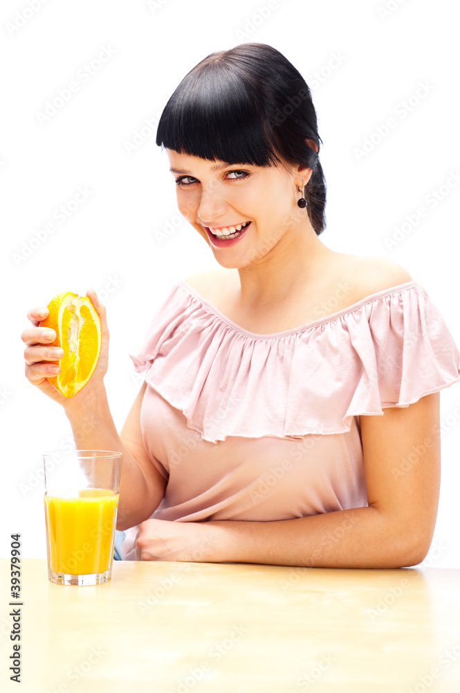 Portrait of woman squeezes the juice from the orange Portrait of woman squeezes the juice from the orange