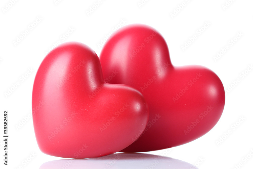 two decorative red hearts isolated on white.