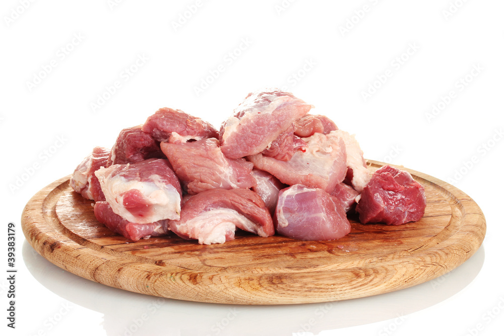 Pieces of raw meat on wooden board isolated on white Pieces of raw meat on wooden board isolated on white