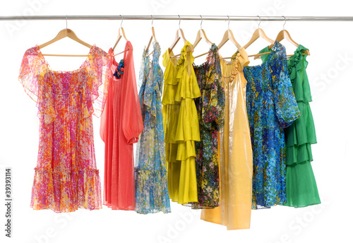 colorful clothes choice of casual clothes on wooden hangers © Mee Ting
