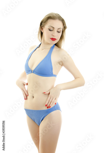 Girl in blue swimwear posing. Isolated on white.