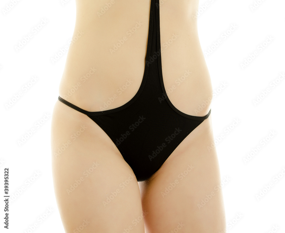 Woman body in black swimsuit. Isolated on white.