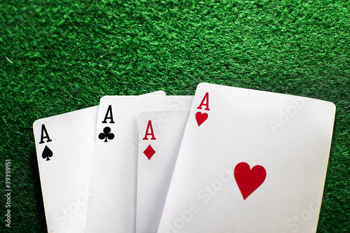 poker of aces on green photo
