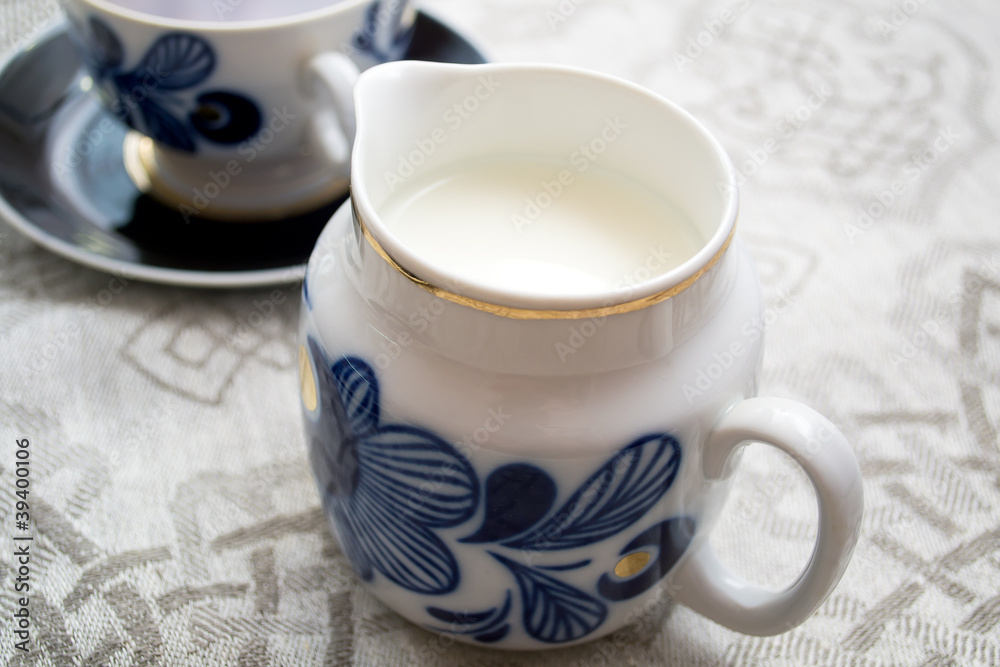 Fototapeta premium milk jug on the table