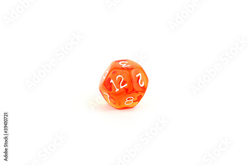 Photo of a translucent orange twelve-sided die on white