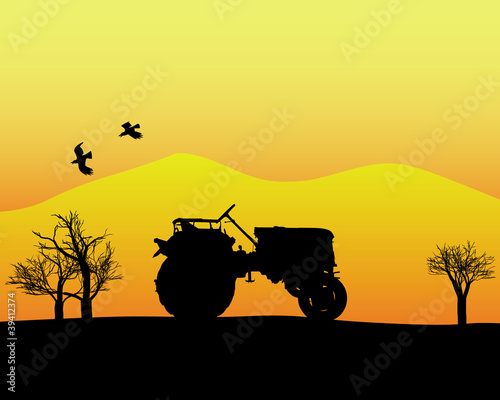 tractor in the background of trees and mountains © Mayboro