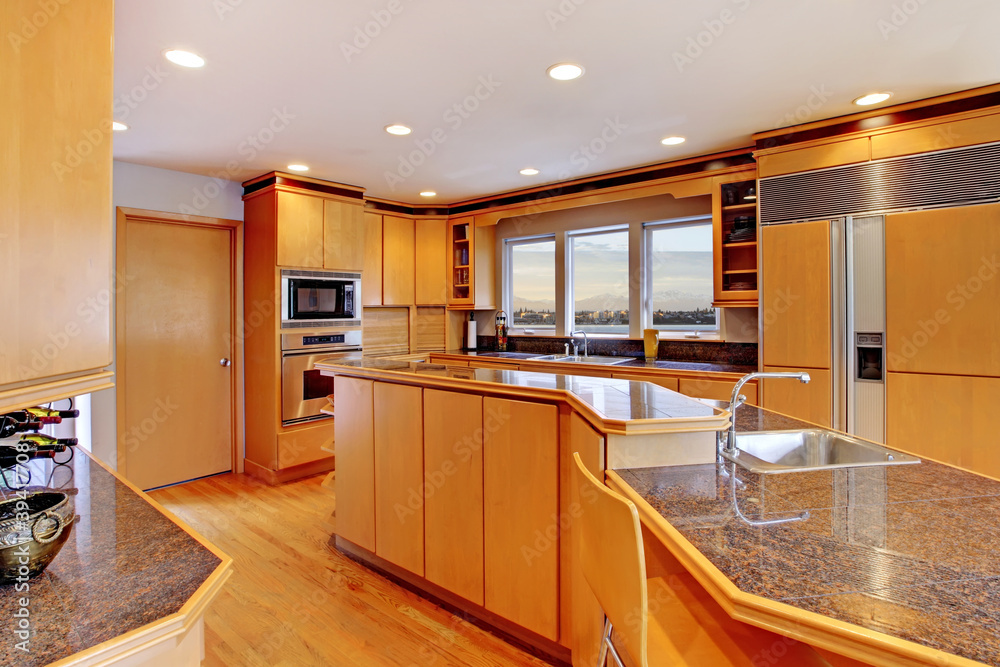 Large luxury modern wood kitchen with granite counter tops. Large luxury modern wood kitchen with granite counter tops.
