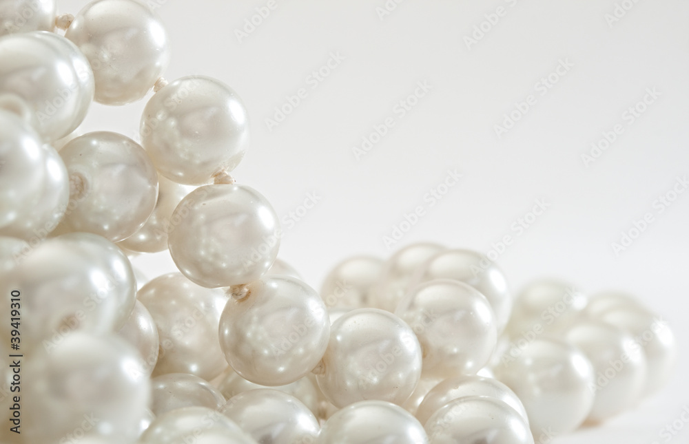 String of pearls on white