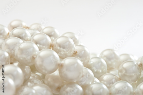 String of pearls on white