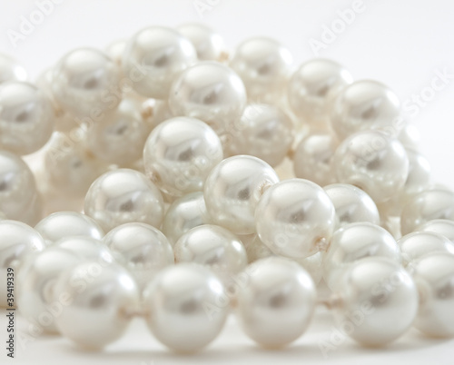 String of pearls on white.
