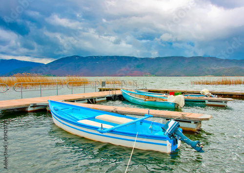 Old wooden fishing boats in the lake Prespa in Greece. © imagIN photography