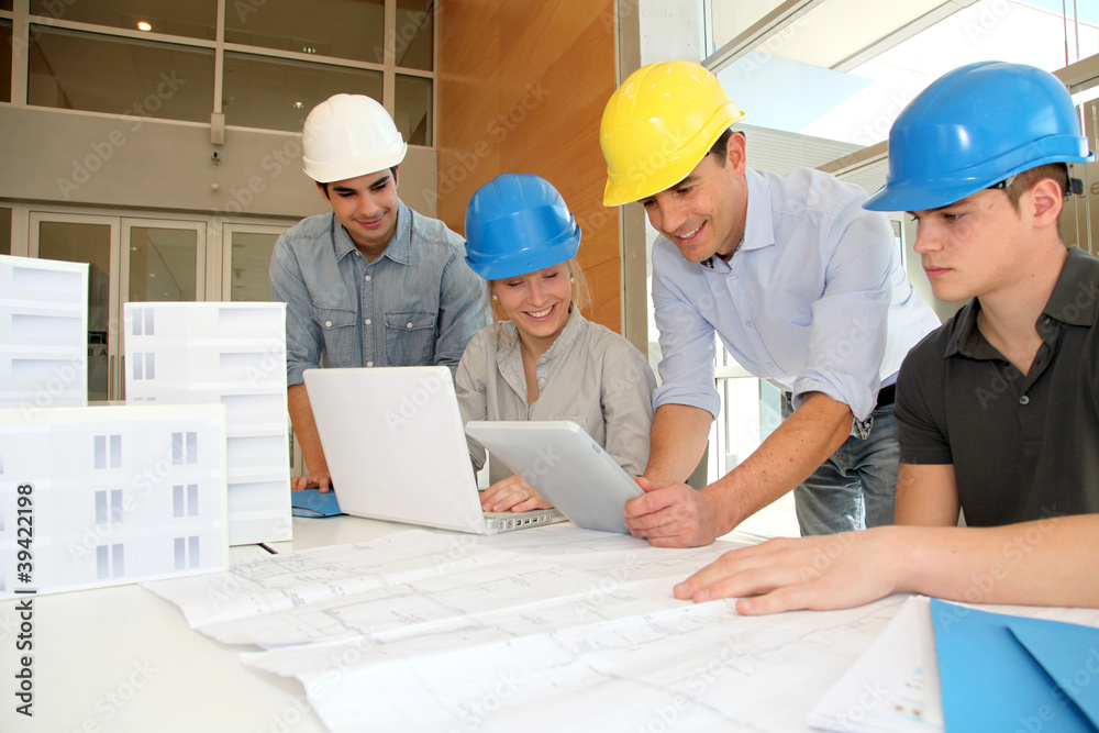 Students in architecture working on electronic tablet Students in architecture working on electronic tablet
