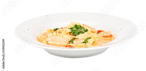 tasty pasta with cream, salmon, cheese and parsley close up