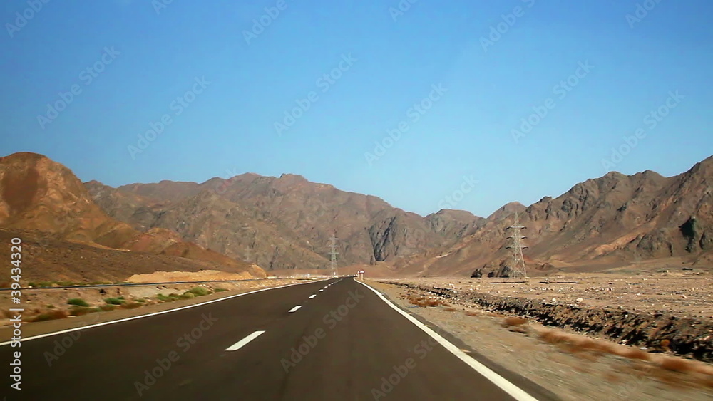Driving through a mountain pass in the desert, Sinai, Egypt. Driving through a mountain pass in the desert, Sinai, Egypt.