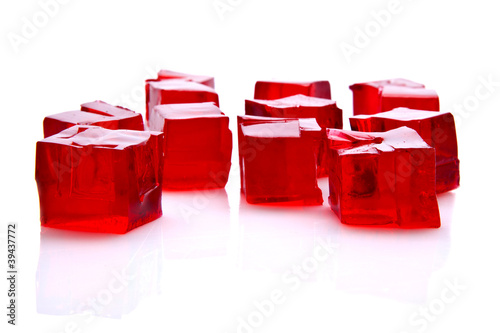 Cubes of red jelly on white background
