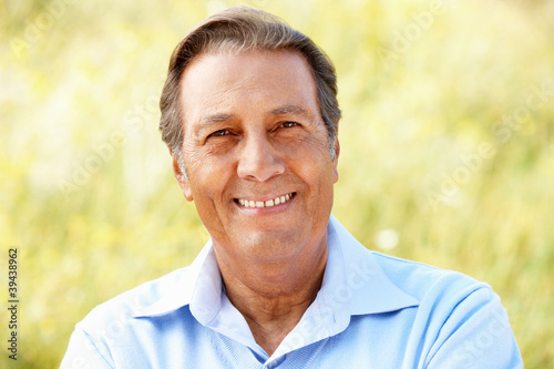 Portrait senior Hispanic man outdoors