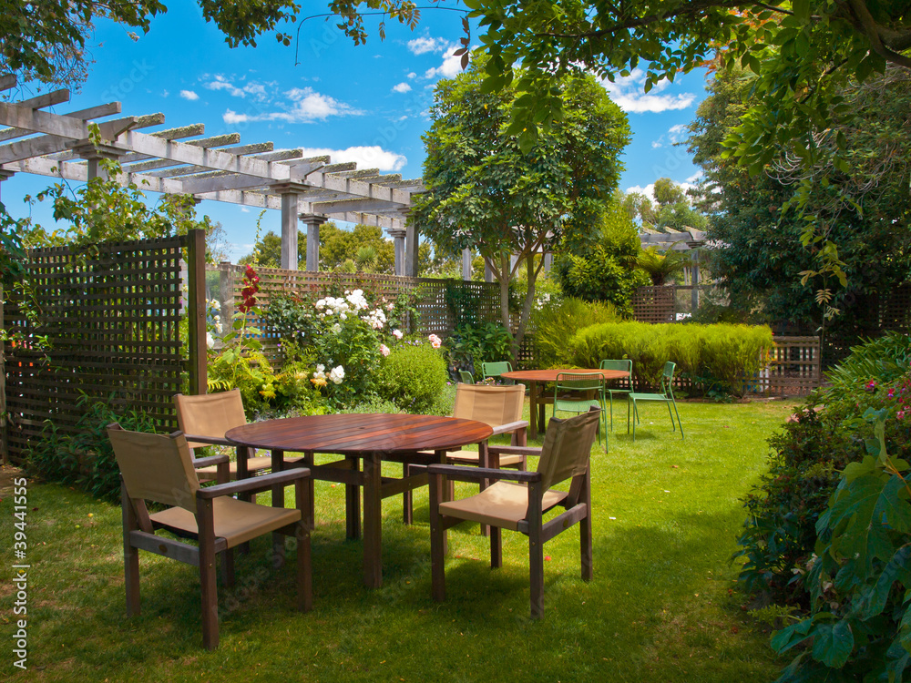 dining table set in lush garden