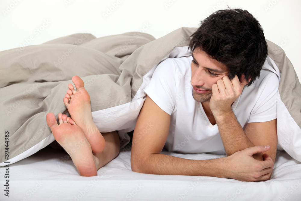 Couple laying in bed
