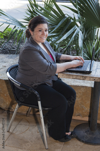 Businesswoman - Telecommuting from Internet Cafe