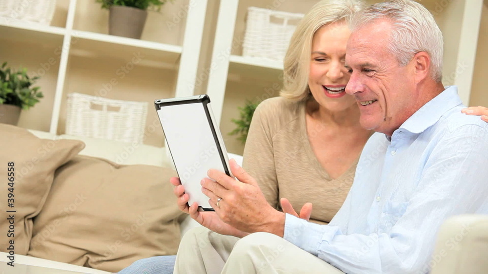 Senior Couple at Home with a Wireless Tablet Senior Couple at Home with a Wireless Tablet